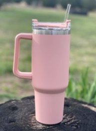 https://www.woodardmercantile.com/wp-content/uploads/2023/04/40-oz-handle-cup-blush-outdoors-scaled-e1682281087773.jpeg
