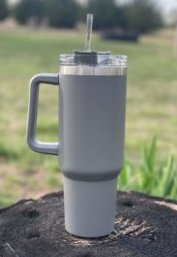 https://www.woodardmercantile.com/wp-content/uploads/2023/04/40-oz-handle-cup-gray-outdoors-scaled-e1682280994538.jpeg