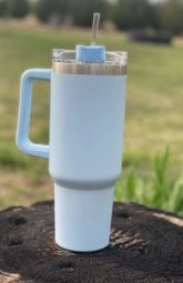 https://www.woodardmercantile.com/wp-content/uploads/2023/04/40-oz-handle-cup-light-blue-outdoors-scaled-e1682280882244.jpeg