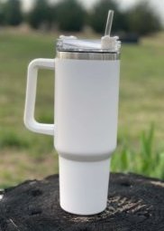 https://www.woodardmercantile.com/wp-content/uploads/2023/04/40-oz-handle-cup-white-outdoors-scaled-e1682281028641.jpeg